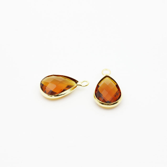 Achat au détail pendentif perle en verre à facettes brique 18x11x5mm avec contours dorés