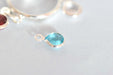 Acheter au détail mini pendentif perle en verre à facettes bleu aigue marine clair 6 mm avec contours argentés