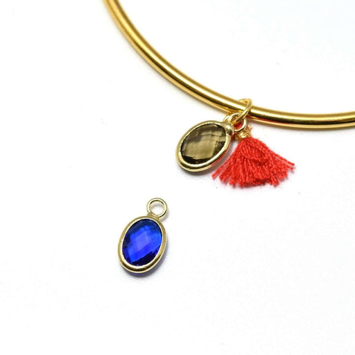 Vente 1 pendentif charm or 12x7x3.5 mm, Trou: 1 mm et verre à facettes bleu saphir avec contours dorés