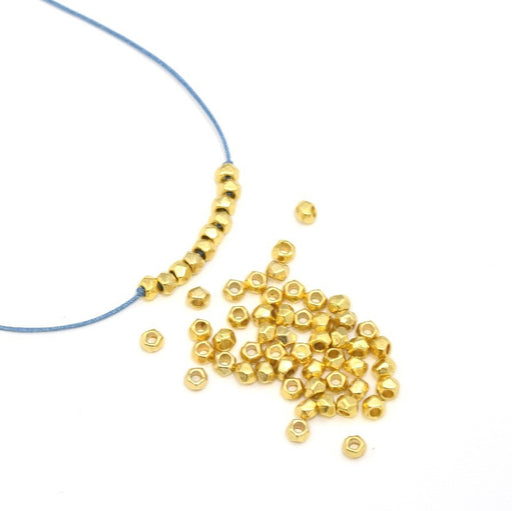 Achat au détail X50 perles octogonales métallisées alliageOR 3x2mm trou 1 mm pour bracelet collier sautoir BO